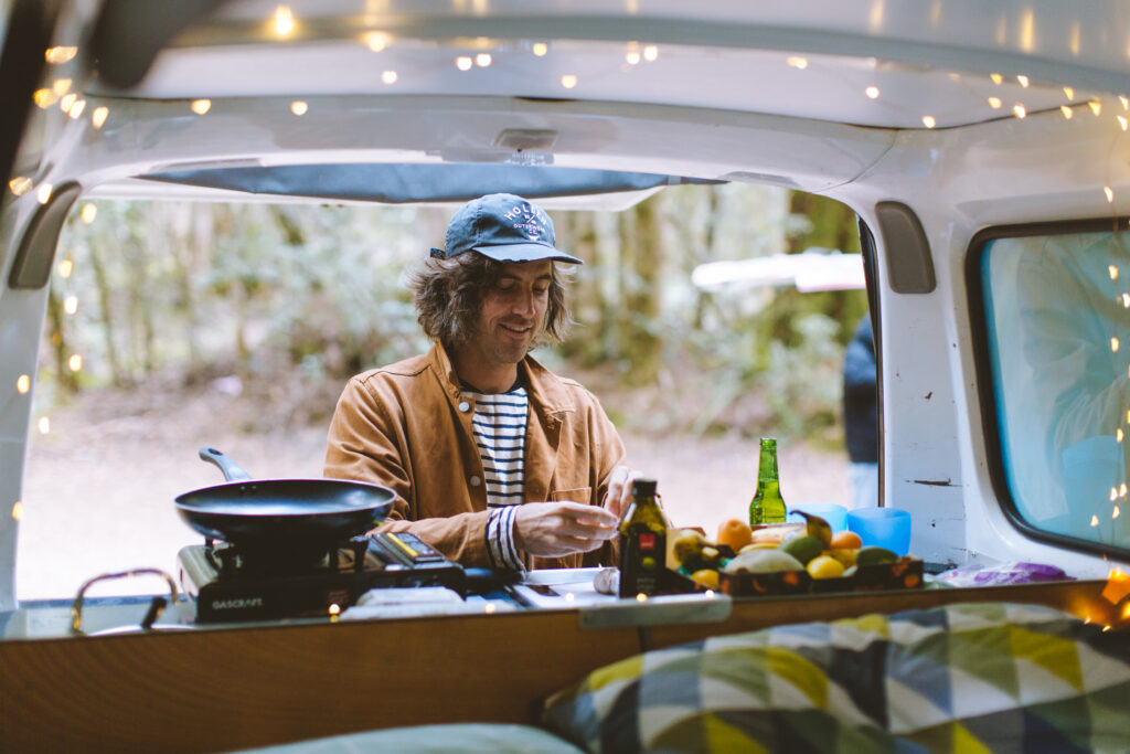 Man cooking in a campervan